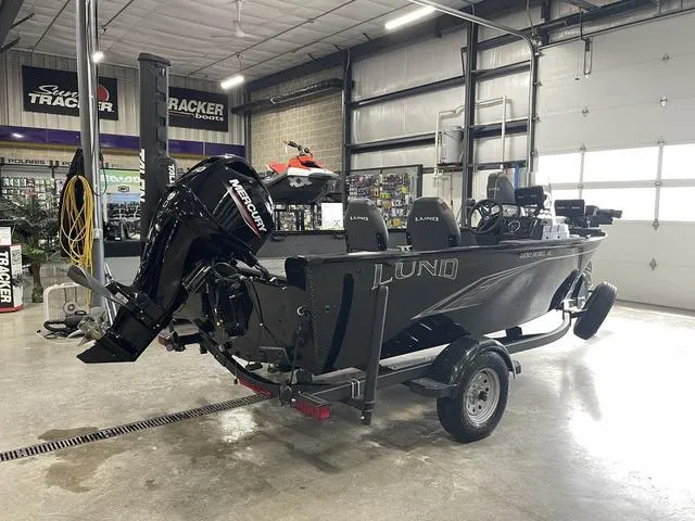 Slide: The Image of 2021 Lund 1650 Rebel XL SS boat with Mercury engine in a showroom. - 6