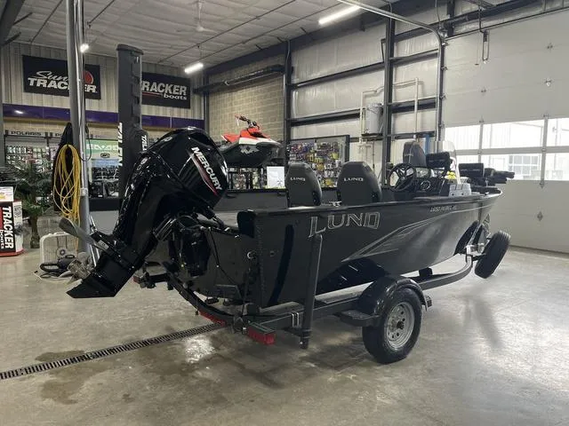 Slide: The Image of 2021 Lund 1650 Rebel XL SS boat with Mercury engine in a showroom. - 7