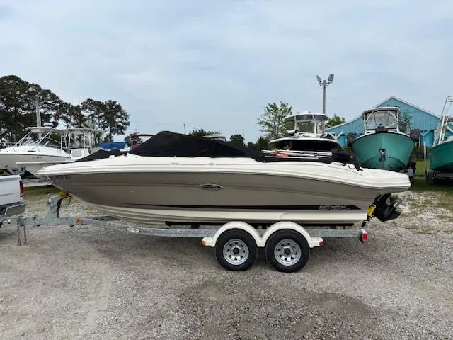 Slide: The Image of 2006 Sea Ray 200 Select boat on trailer, parked outdoors, side view. - 14