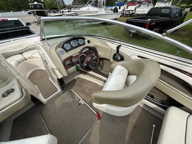 Slide: The Image of 2006 Sea Ray 200 Select boat interior with steering wheel and seating. - 18