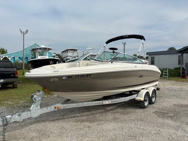 Slide: The Image of 2006 Sea Ray 200 Select boat on trailer, parked outdoors. - 2