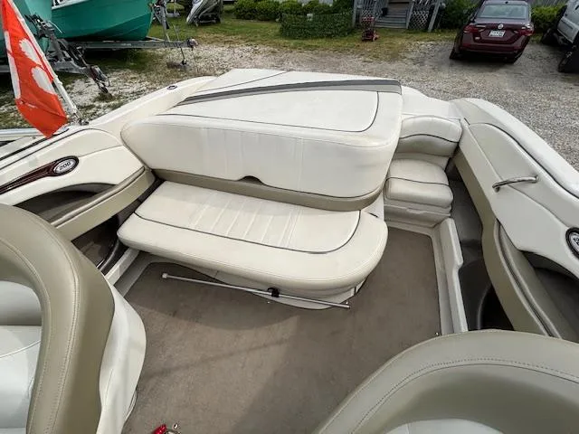 Slide: The Image of 2006 Sea Ray 200 Select boat interior with white leather seating and carpeted floor. - 20
