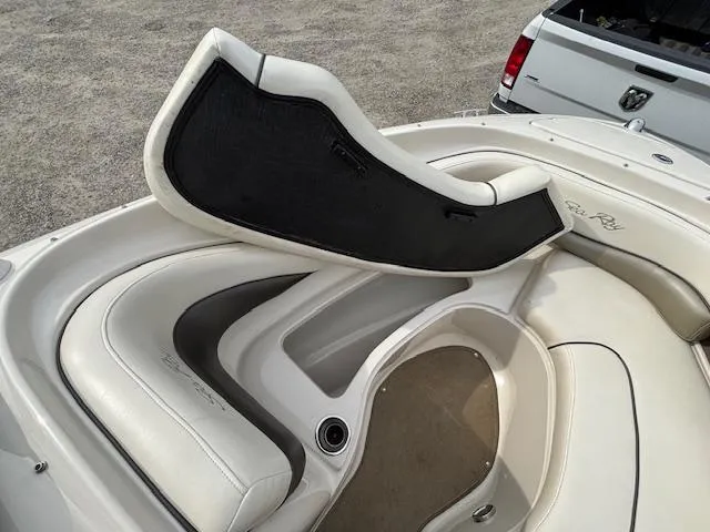 Slide: The Image of 2006 Sea Ray 200 Select boat interior with white seating and storage compartment. - 24