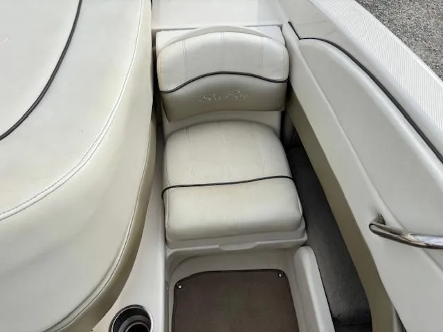 Slide: The Image of 2006 Sea Ray 200 Select boat interior with white cushioned seating. - 26