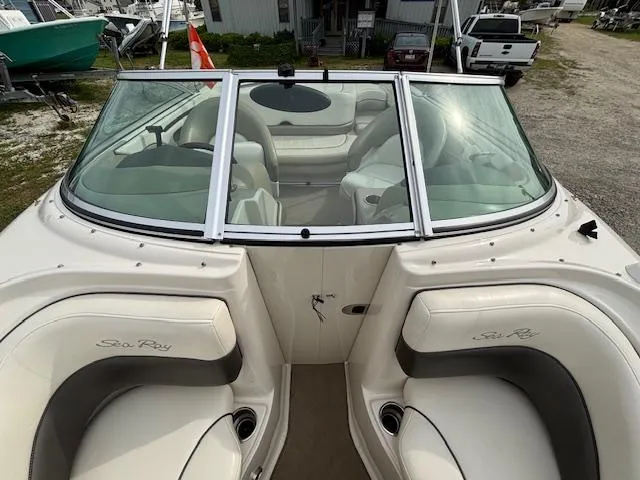 Slide: The Image of 2006 Sea Ray 200 Select boat interior with white seating and windshield. - 28