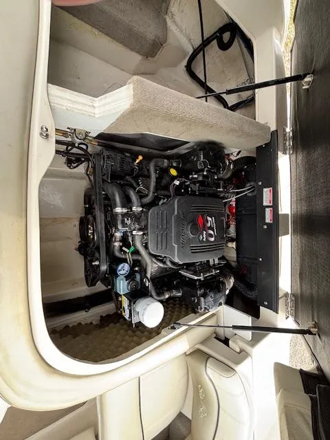 Slide: The Image of Engine compartment of a 2006 Sea Ray 200 Select boat, showcasing detailed mechanical components. - 29