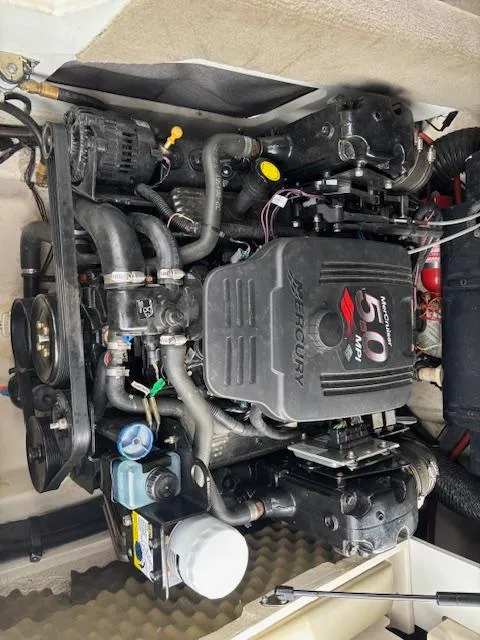 Slide: The Image of 2006 Sea Ray 200 Select engine compartment with MerCruiser 5.0L V8 engine. - 30
