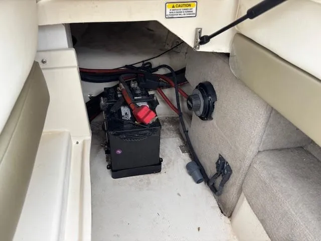 Slide: The Image of 2006 Sea Ray 200 Select boat interior showing battery compartment and wiring. - 31