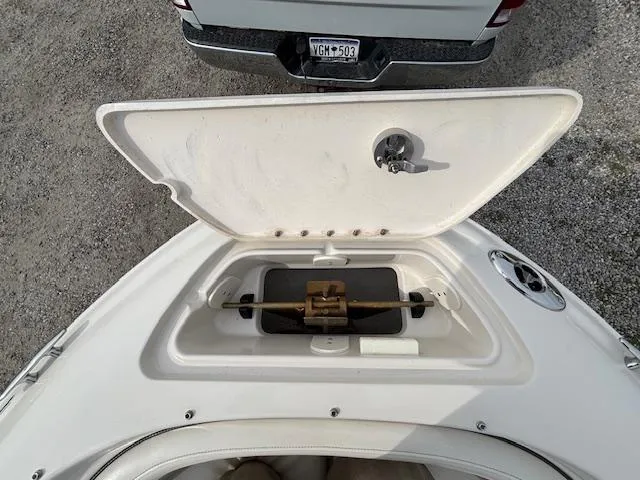 Slide: The Image of 2006 Sea Ray 200 Select boat anchor compartment open, showing storage details. - 33