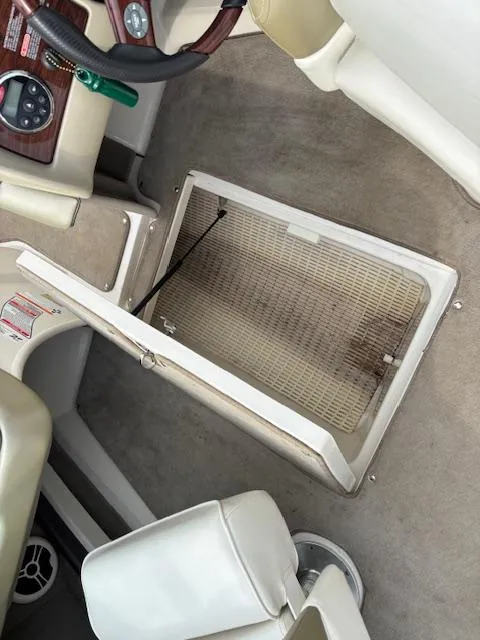 Slide: The Image of 2006 Sea Ray 200 Select boat interior with open storage compartment. - 36