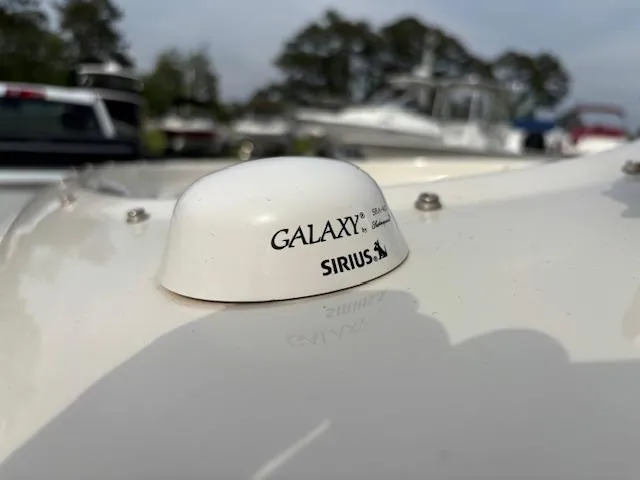 Slide: The Image of 2006 Sea Ray 200 Select with Galaxy Sirius antenna on deck. - 40