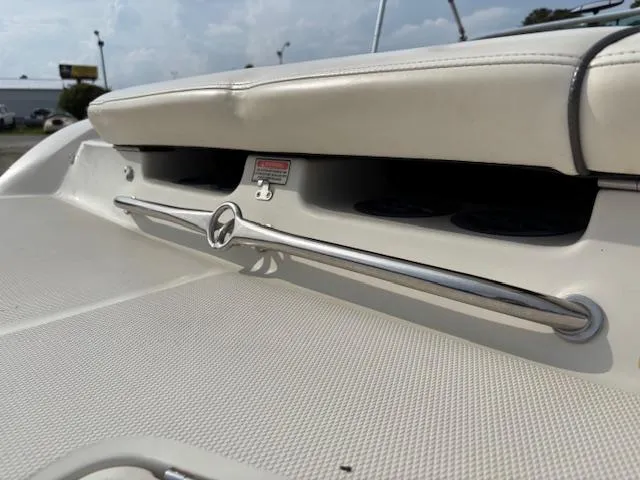Slide: The Image of 2006 Sea Ray 200 Select boat interior with cushioned seating and stainless steel grab rail. - 43