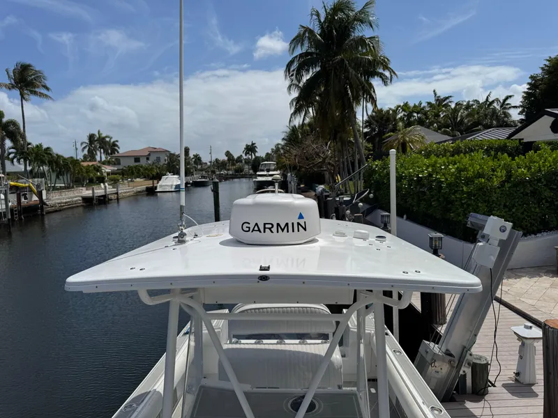 Slide: The Image of 2005 Regulator 23 Center Console boat with Garmin equipment on a scenic canal. - 10
