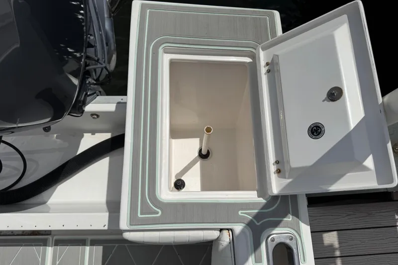 Slide: The Image of Open storage compartment on 2005 Regulator 23 Center Console boat. - 19