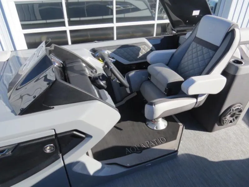 Slide: The Image of Captain's seat and helm of 2023 Godfrey AquaPatio 255 ULC pontoon boat. - 10