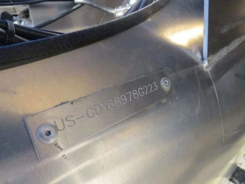 Slide: The Image of 2023 Godfrey AquaPatio 255 ULC boat hull identification number (HIN) plate close-up. - 12