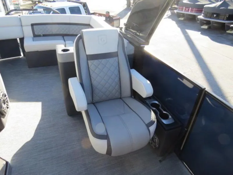 Slide: The Image of 2023 Godfrey AquaPatio 255 ULC boat interior with luxurious seating and cup holders. - 14