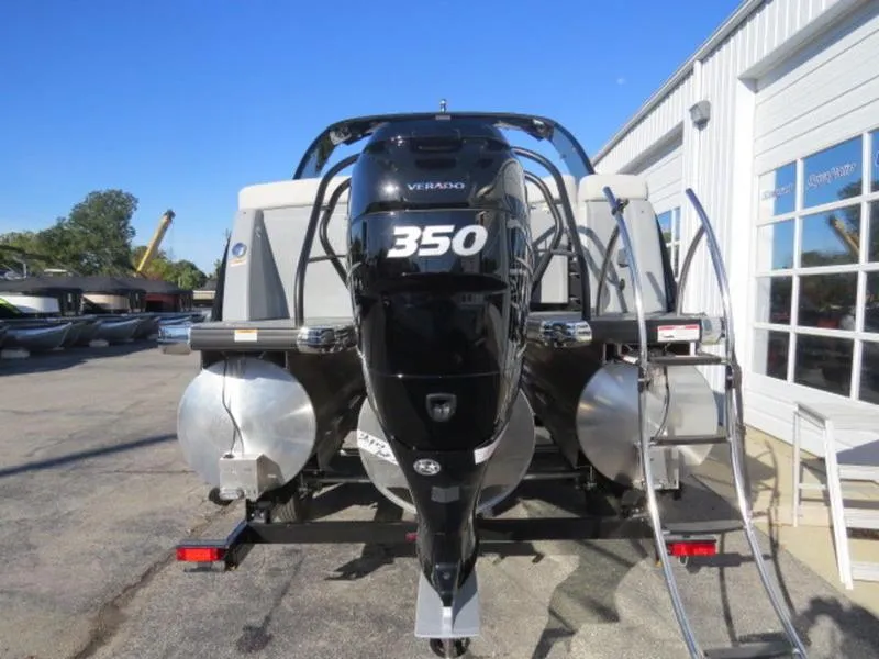 Slide: The Image of 2023 Godfrey AquaPatio 255 ULC boat with powerful 350 Verado engine, parked outdoors. - 5