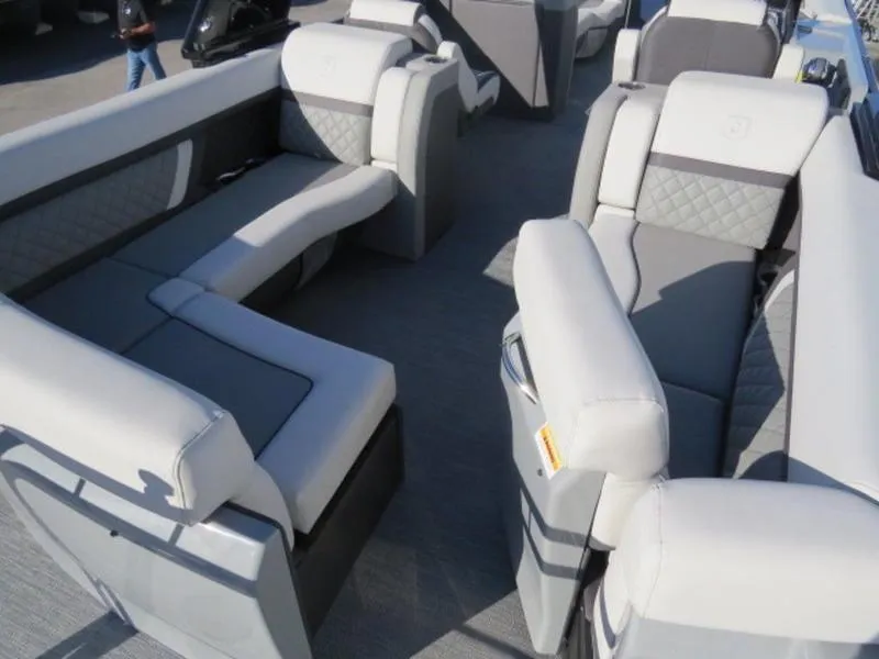 Slide: The Image of 2023 Godfrey AquaPatio 255 ULC boat interior with luxurious seating and modern design. - 6
