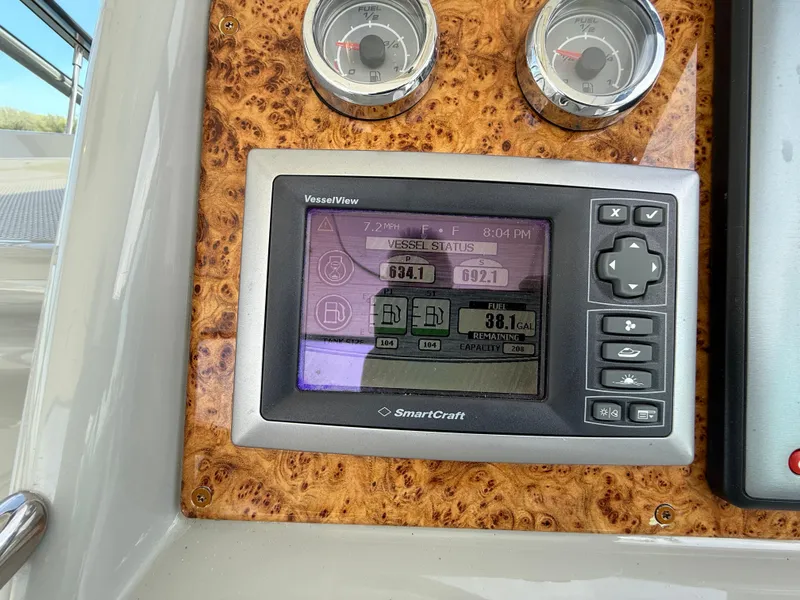 Slide: The Image of SmartCraft VesselView display on 2011 Formula 340PC dashboard with wood grain panel. - 14