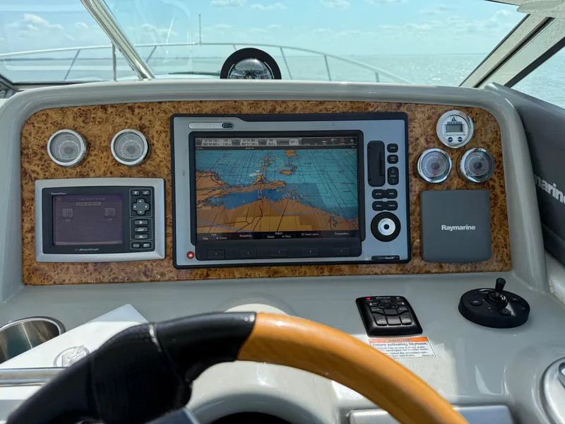 Slide: The Image of Dashboard of a 2011 Formula 340PC boat with navigation screens and controls. - 7