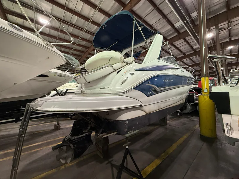Slide: The Image of 2007 Crownline 250 CR boat in storage, showcasing sleek design and spacious interior. - 3
