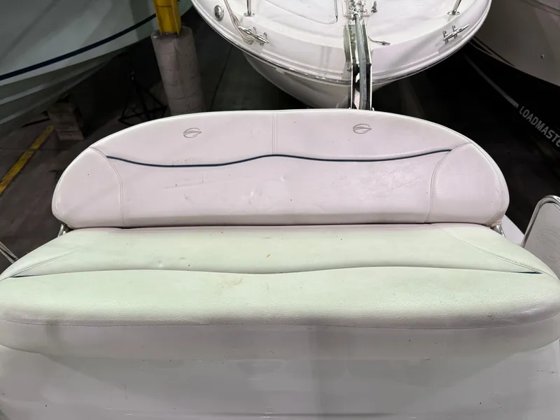 Slide: The Image of 2007 Crownline 250 CR boat seat, white upholstery, indoor storage. - 7