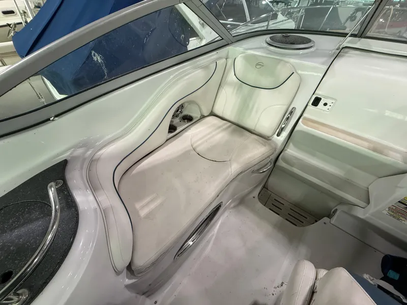 Slide: The Image of 2007 Crownline 250 CR boat interior with white seating and sleek design. - 9