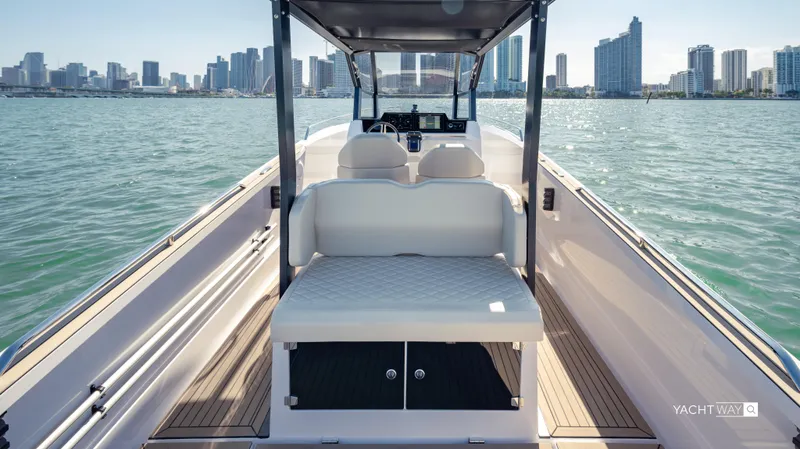 Slide: The Image of 2025 Rand Roamer boat on water with city skyline in background. - 10