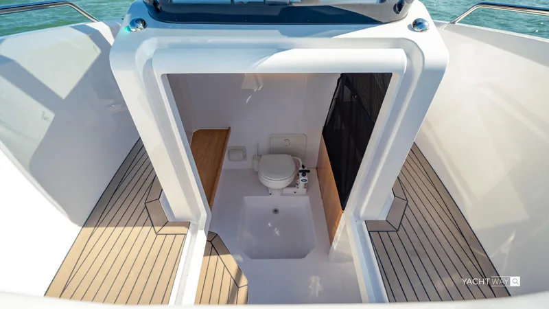 Slide: The Image of 2025 Rand Roamer boat interior with modern bathroom and wooden flooring. - 6