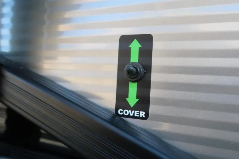 Slide: The Image of Close-up of a 2021 Bennington R Bowrider Quad Bench 24 RTFB cover switch. - 16