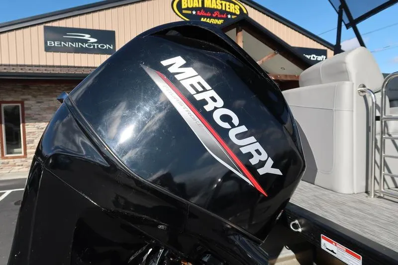Slide: The Image of 2021 Bennington R Bowrider Quad Bench 24 RTFB with Mercury engine at dealership. - 21
