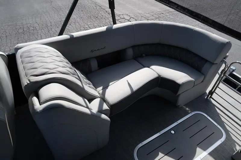 Slide: The Image of 2021 Bennington R Bowrider Quad Bench 24 RTFB, luxurious seating, gray upholstery, outdoor setting. - 24