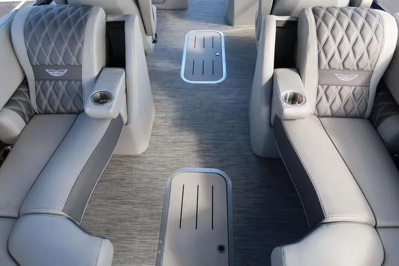Slide: The Image of Luxurious interior of 2021 Bennington R Bowrider Quad Bench 24 RTFB with plush seating. - 26