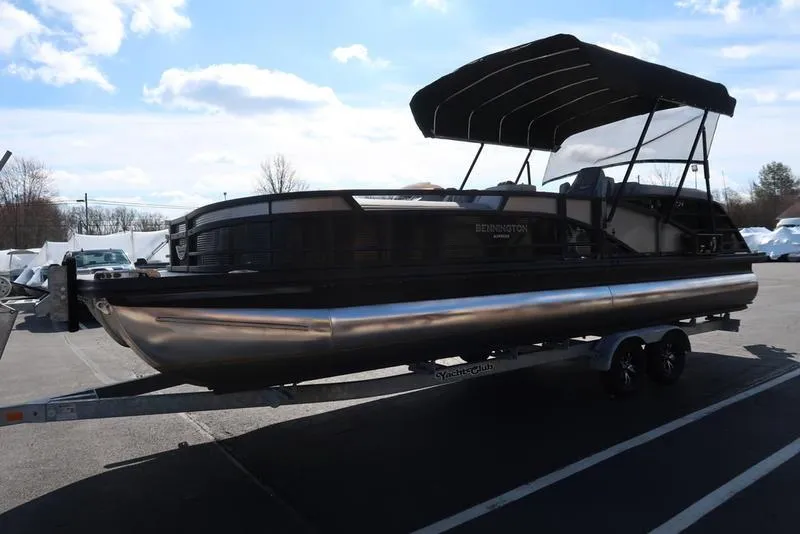 Slide: The Image of 2021 Bennington R Bowrider Quad Bench 24 RTFB pontoon boat on trailer. - 3