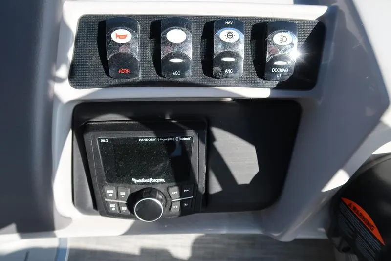 Slide: The Image of Control panel of 2021 Bennington R Bowrider Quad Bench 24 RTFB with Rockford Fosgate audio system. - 34