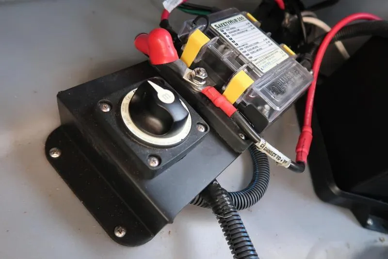 Slide: The Image of Battery switch and wiring in a 2021 Bennington R Bowrider Quad Bench 24 RTFB boat. - 38