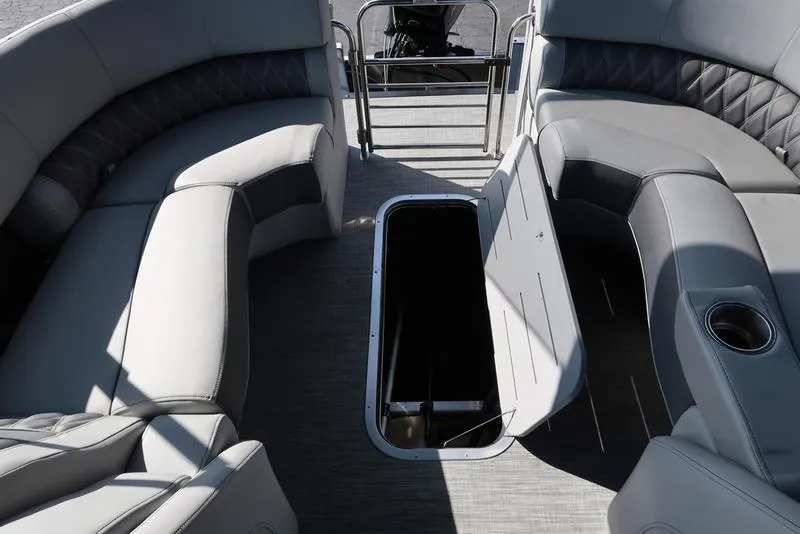 Slide: The Image of 2021 Bennington R Bowrider Quad Bench 24 RTFB interior with open storage compartment. - 44