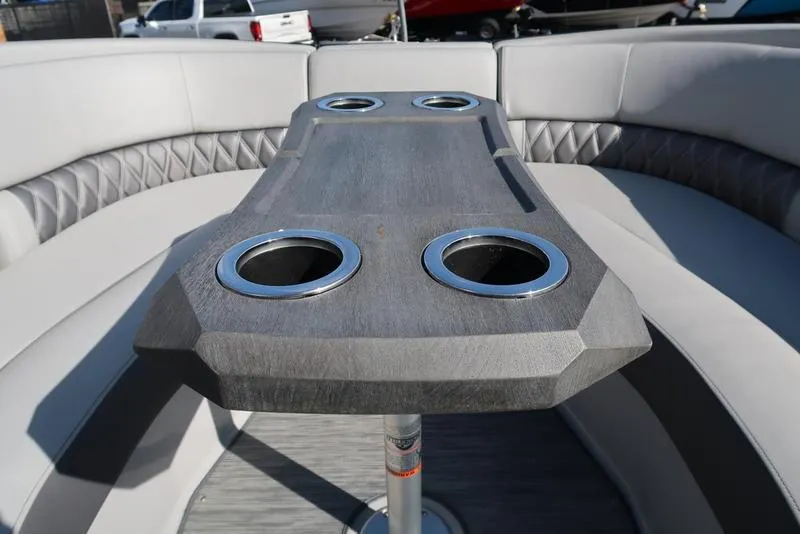 Slide: The Image of 2021 Bennington R Bowrider Quad Bench 24 RTFB interior with cup holders and seating. - 47