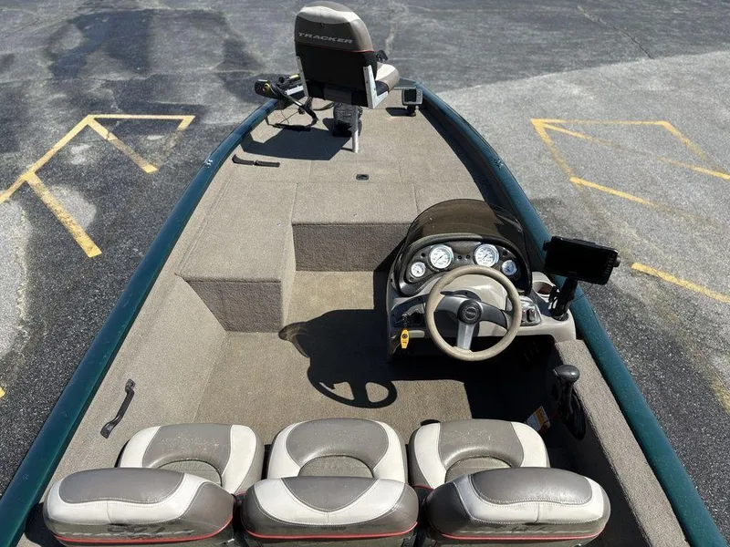 Slide: The Image of 2004 Tracker Pro Team 185 boat interior with steering console and seating. - 12
