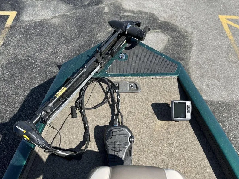 Slide: The Image of 2004 Tracker Pro Team 185 boat deck with trolling motor and fish finder. - 13