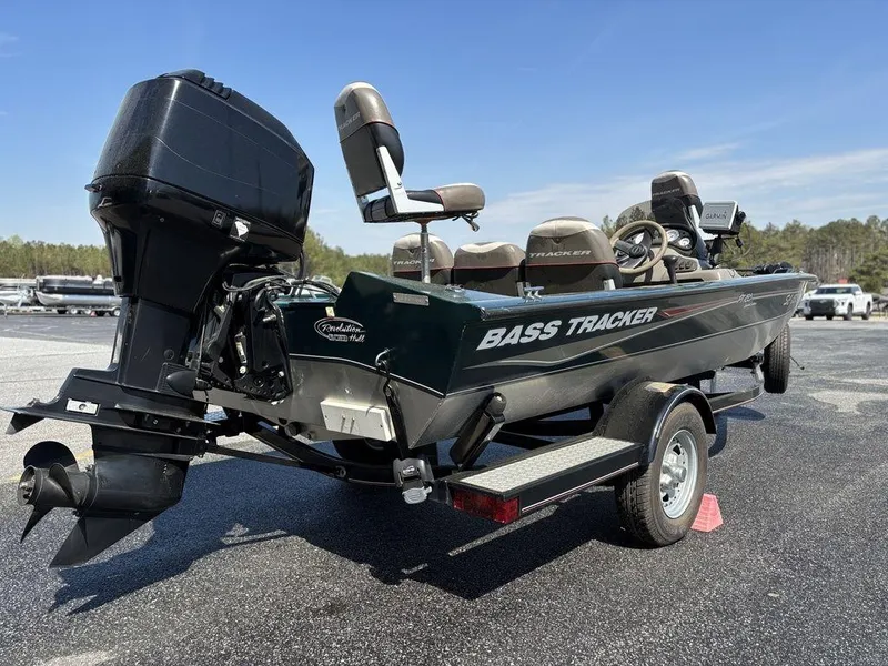 Slide: The Image of 2004 Tracker Pro Team 185 bass boat on trailer, rear view, outdoors. - 3