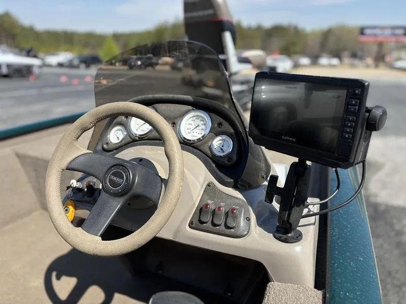 Slide: The Image of 2004 Tracker Pro Team 185 boat dashboard with steering wheel and Garmin GPS. - 6