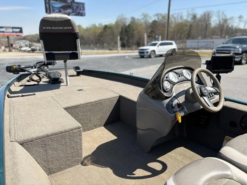 Slide: The Image of 2004 Tracker Pro Team 185 boat interior with steering wheel and seating. - 9