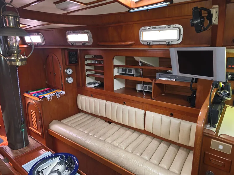 Slide: The Image of Luxurious 1982 Stevens 40" yacht interior with leather seating, wood paneling, and modern amenities. - 6