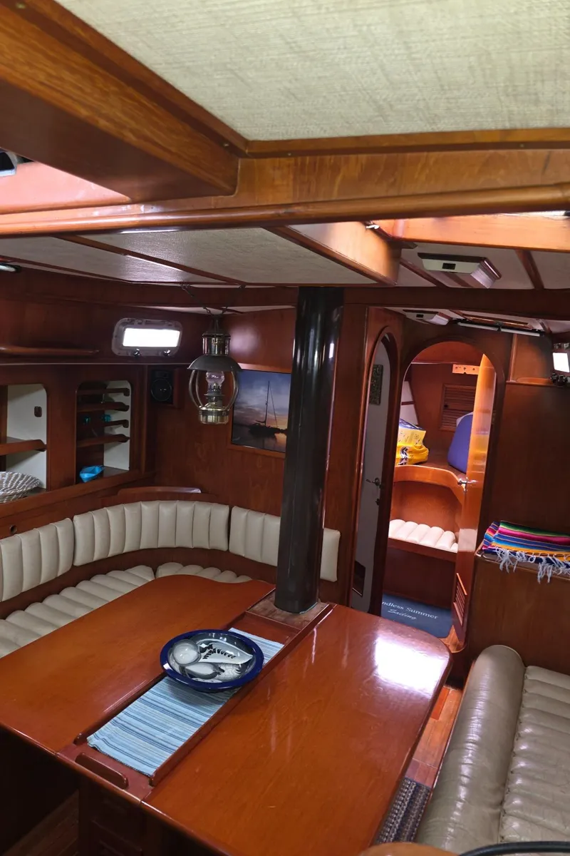 Slide: The Image of Interior of a 1982 Stevens 40" yacht with wooden furnishings and cozy seating. - 8