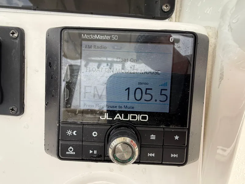 Slide: The Image of JL Audio MediaMaster 50 displaying FM radio station 105.5 on a 2022 Tidewater 232 CC Adventure. - 11