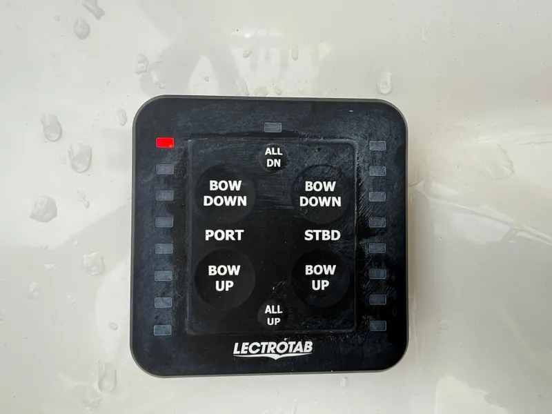 Slide: The Image of Control panel for trim tabs on 2022 Tidewater 232 CC Adventure boat. - 12