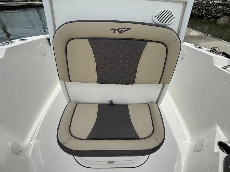 Slide: The Image of 2022 Tidewater 232 CC Adventure boat seat with beige and gray upholstery. - 18