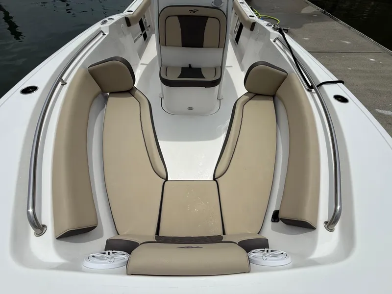 Slide: The Image of 2022 Tidewater 232 CC Adventure boat interior with beige seating and stainless steel rails. - 20